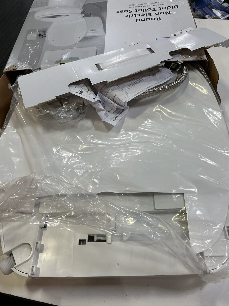 Condition photo showing As Is for mainstays round non-electric bidet toilet seat with dual self-cleaning nozzles, daisy white
