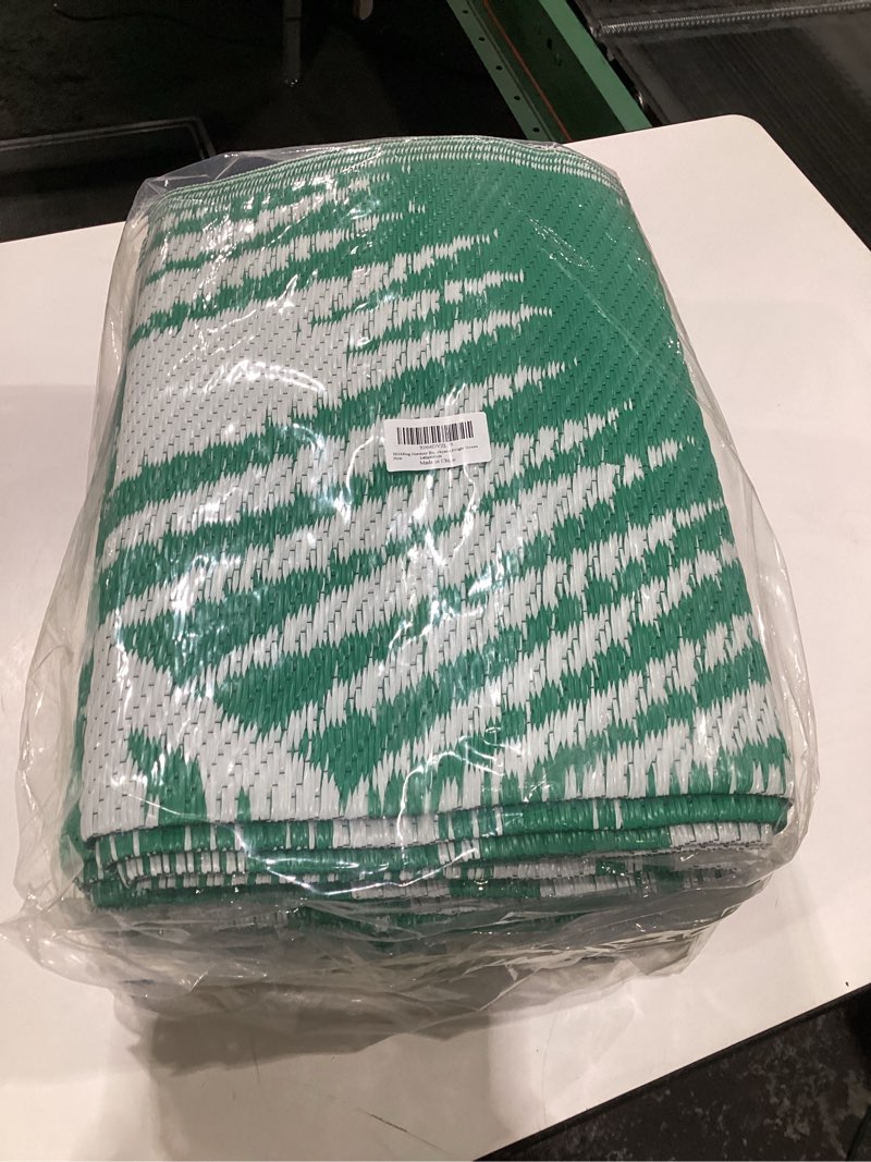 Condition photo showing New/Like New for Outdoor Rug 8'x10' Waterproof for Patios Clearance, Reversible Outdoor Plastic Straw Rug Camping Carpet, Outside Floor Mats Large Area Rugs for RV,Patio,Deck,Porch, Beach,Balcony,Green&White 8' x 10' (Rectangular) Green&white