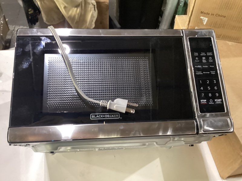 Condition photo showing As Is for door not opening black+decker em720cb7 digital microwave oven with turntable push-button door, child safety lock, 700w, stainless steel, 0.7 cu.ft 0.7 cu. ft.