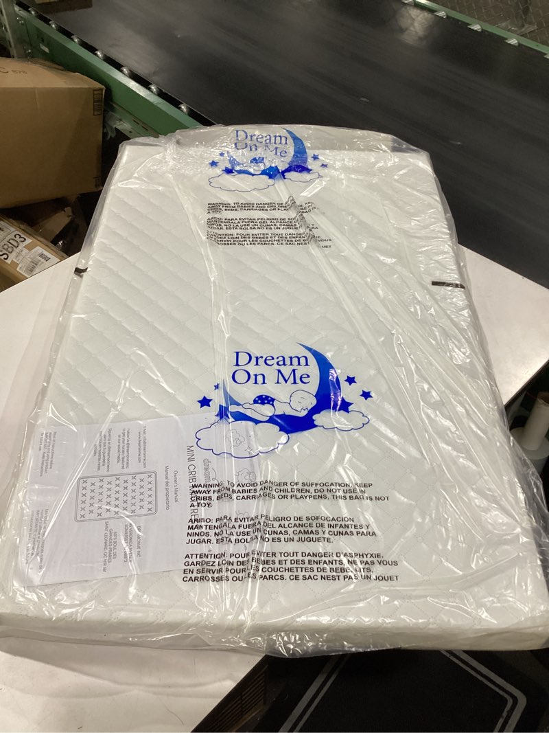 Condition photo showing New/Like New for dream on me holly 2-in-1 mini crib mattress, dual-sided infant & toddler, waterproof cover, greenguard gold certified, 38” x 24” x 3”, fits mini & select portable cribs, not for playards