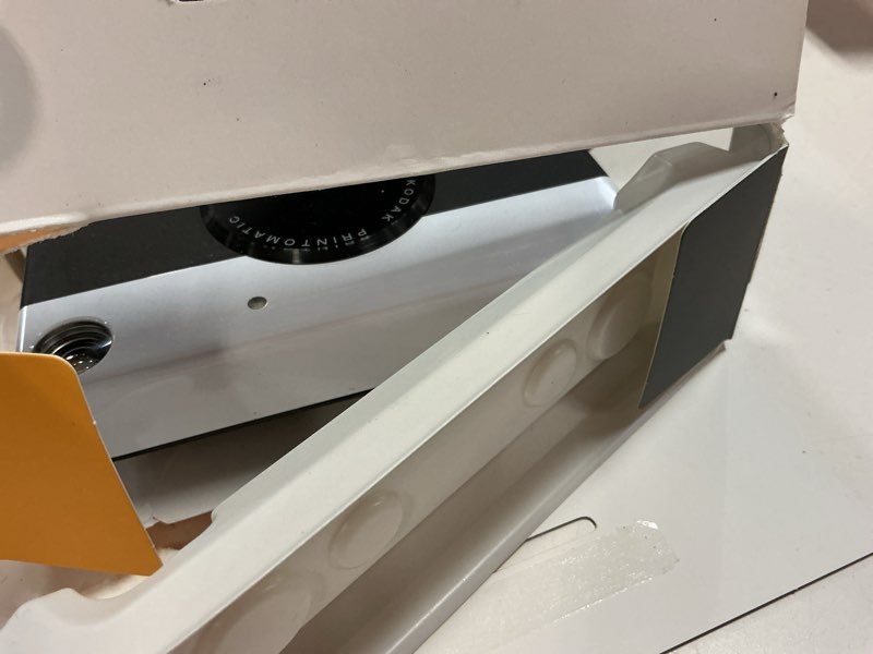 Condition photo showing Good Condition for kodak printomatic instant camera bundle (black) zink paper (20 sheets) - case - photo album - hanging frames.