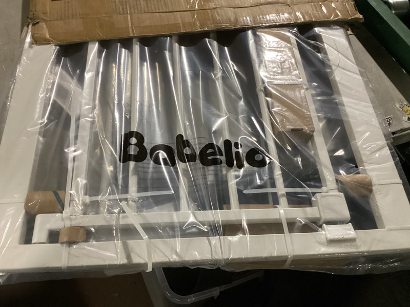 Condition photo showing New/Like New for babelio baby gate for doorways and stairs, 26-31" pet gate with wide walk thru door and lock indicator, no drill pressure mounted safety gate with double lock and self-closing, white white 26-31"w, 30"h