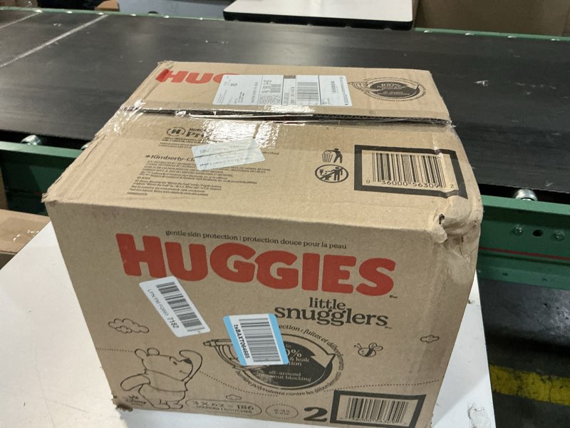Condition photo showing New/Like New for huggies size 2 diapers, little snugglers baby diapers, size 2 (12-18 lbs), 186 count (3 packs of 62), packaging may vary