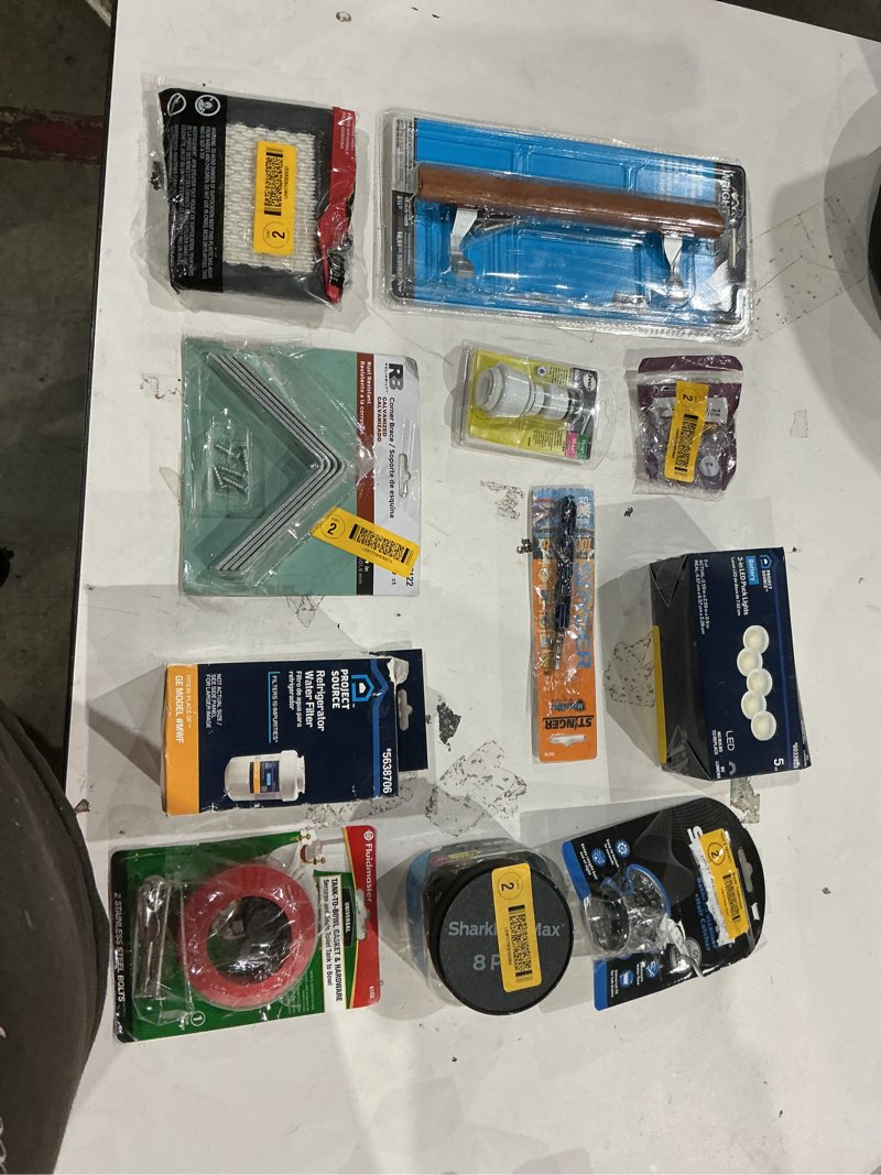 Condition photo showing As Is for assorted home improvement lot (small tools, screw, home accessories, etc.)
