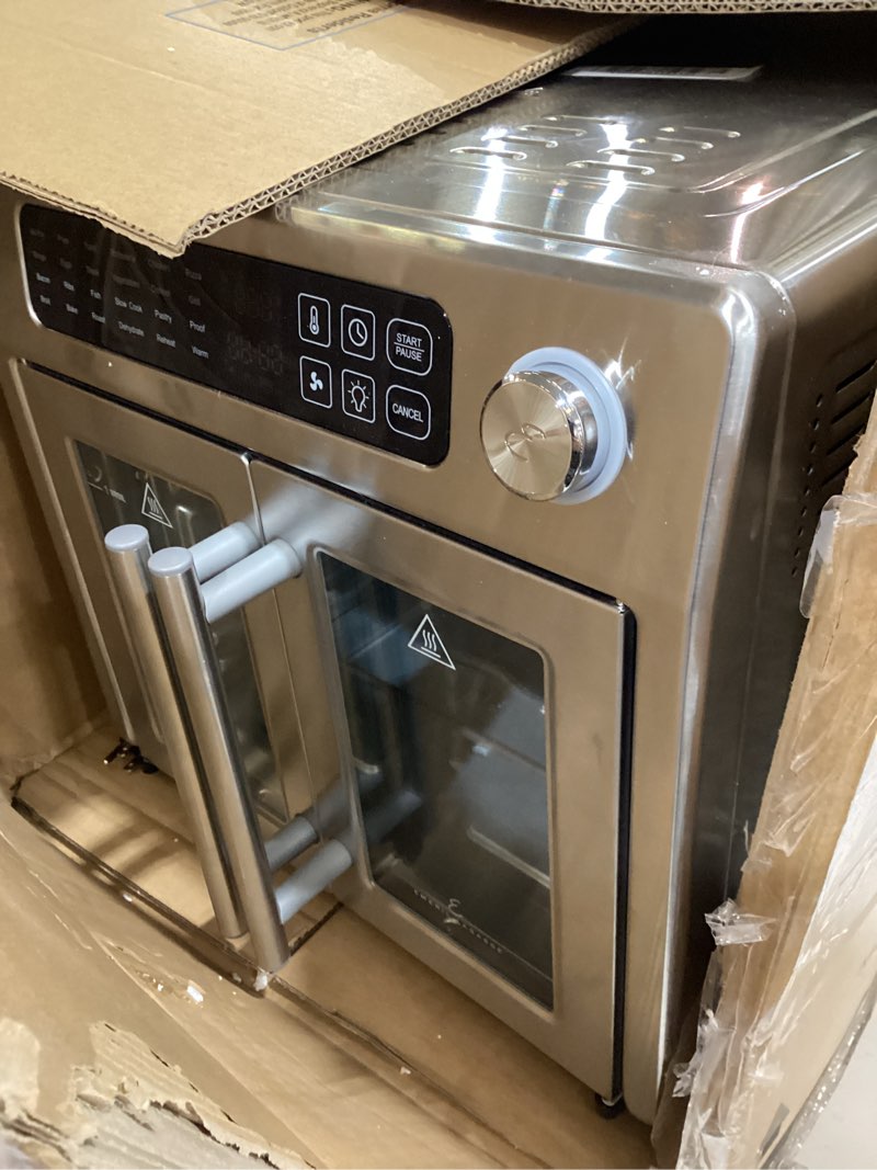 Condition photo showing As Is for dan - emeril lagasse extra large french door air fryer toaster oven combo, 24 cooking functions and digital controls, 7 accessories included, stainless steel finish, 26qt capacity