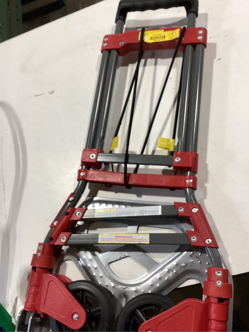 Condition photo showing As Is for milwaukee 150-lb capacity 2 -wheel red steel folding hand truck