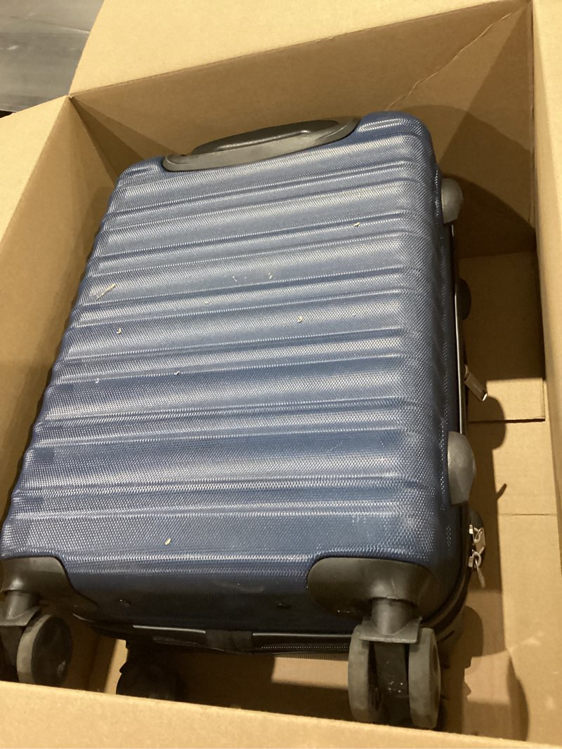 Condition photo showing Good Condition for Amazon Basics 21" Hardside Carry-On Luggage, Hardshell Suitcase With Wheels, Expandable For Up to 25% More Space, With Scratch-Resistant Surface, Four Multi-directional Wheels, Navy Blue Navy Blue Carry-On