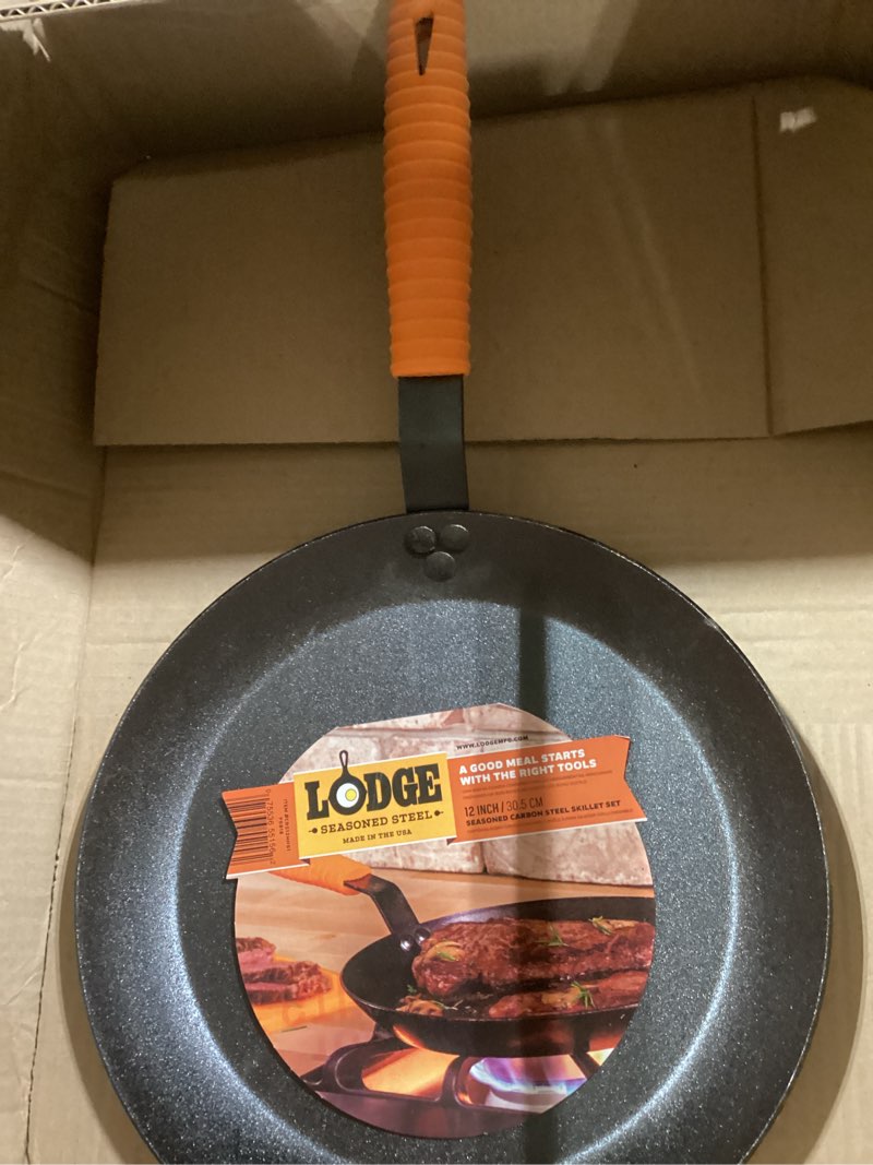Condition photo showing Good Condition for Lodge Manufacturing Company carbon steel skillet, Black/Orange, 12-Inch 12 Inch Skillet