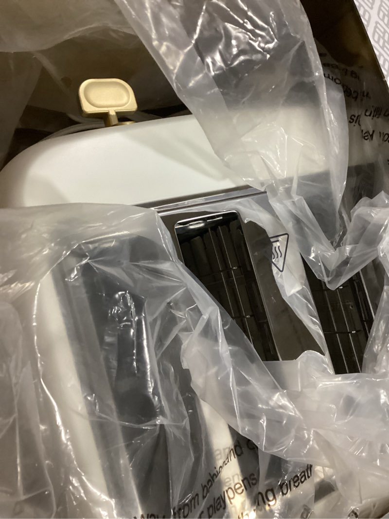 Condition photo showing Good Condition for West Bend Timeless 4-Slice Toaster with 7 Browning Levels, Bagel/Waffle/Defrost Settings, High-Lift Lever, Anti-Jam, Easy-Clean Crumb Tray, 4-Slice, White/Gold