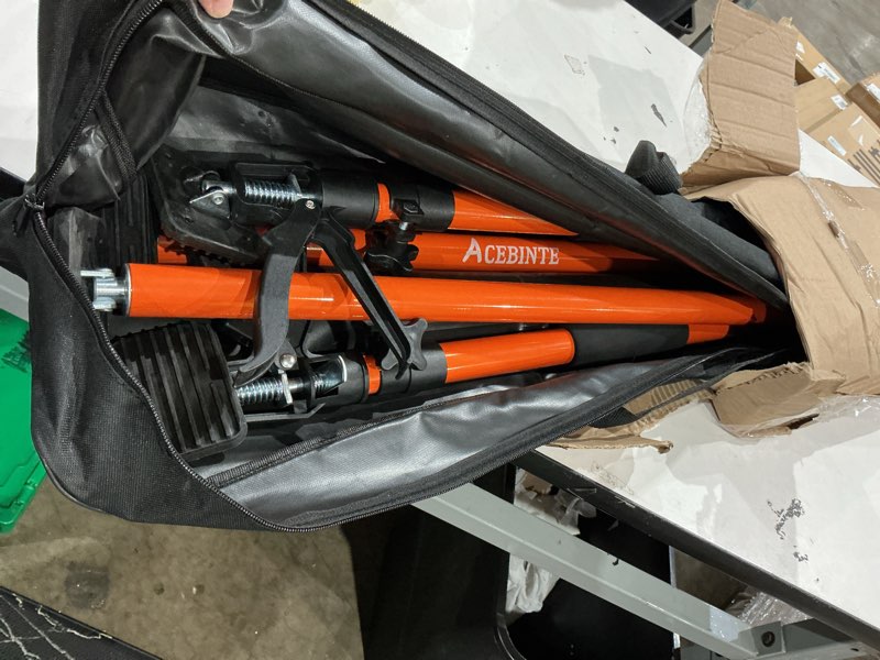 Condition photo showing As Is for 4pk support pole, steel telescopic adjustable 3rd hand support system, support rod, supports up to 154 lbs construction rods for cabinet jacks cargo bars drywalls extends from 49 inch to 114 inch