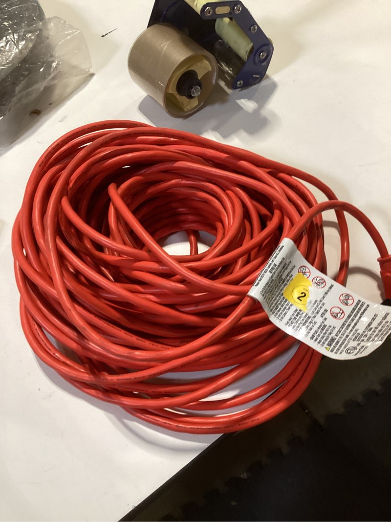 Condition photo showing As Is for amazon basics 100 foot 3-prong vinyl indoor/outdoor extension cord - 10 amps, 1250 watts, 125 vac - orange 100 ft orange