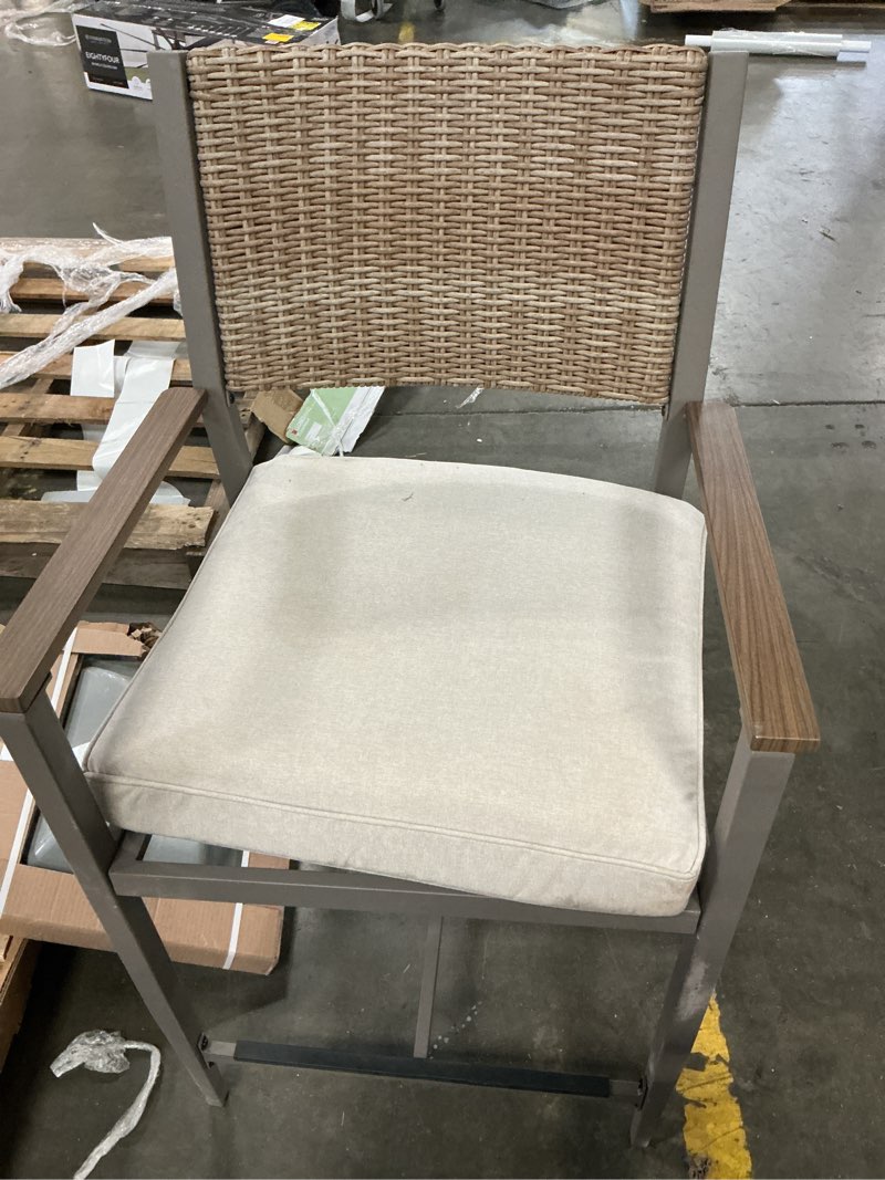 Condition photo showing As Is for wicker gray steel frame stationary counter-height chair with cream cushioned seat