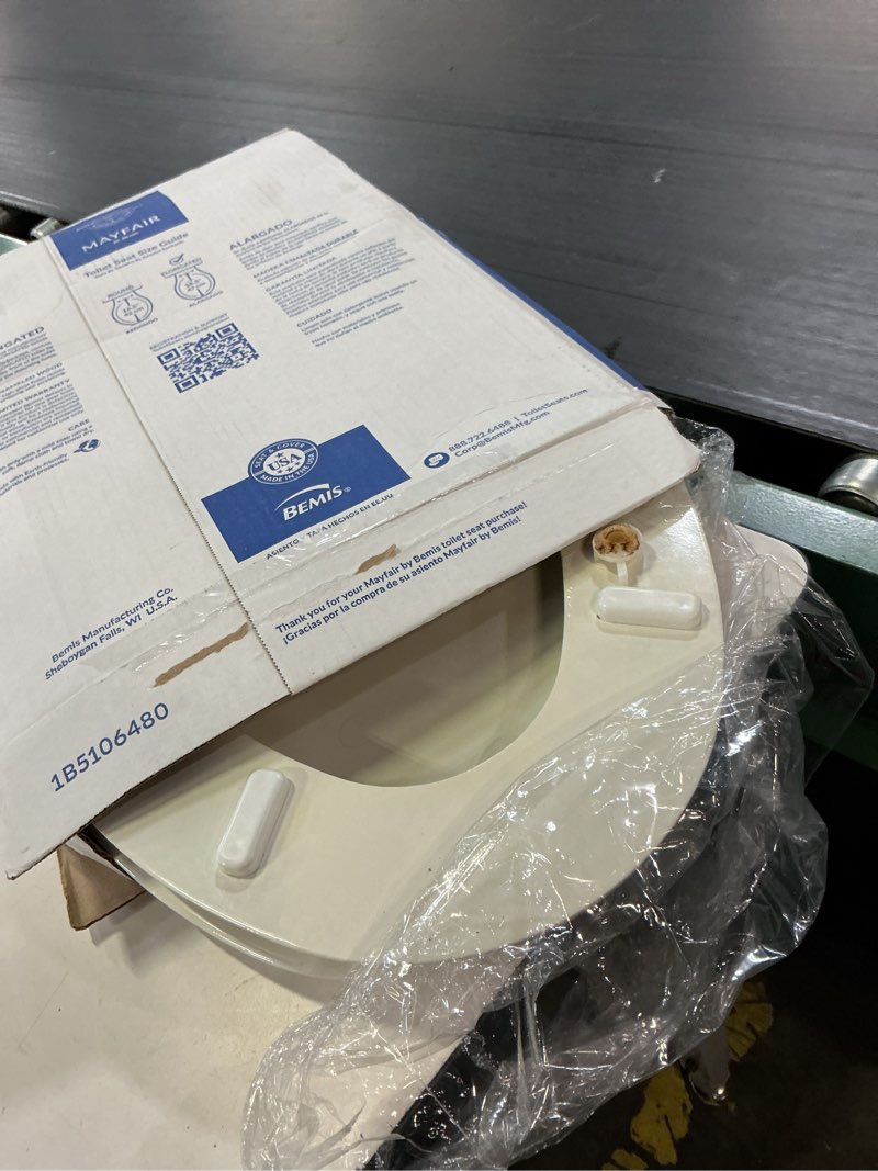 Condition photo showing As Is for mayfair by bemis nextstep2 wood white elongated soft close toilet seat