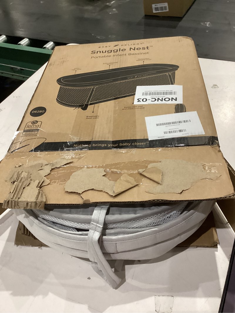 Condition photo showing As Is for Baby Delight Snuggle Nest Bassinet, Portable Baby Bed, for Infants 0 – 5 Months, Driftwood Grey