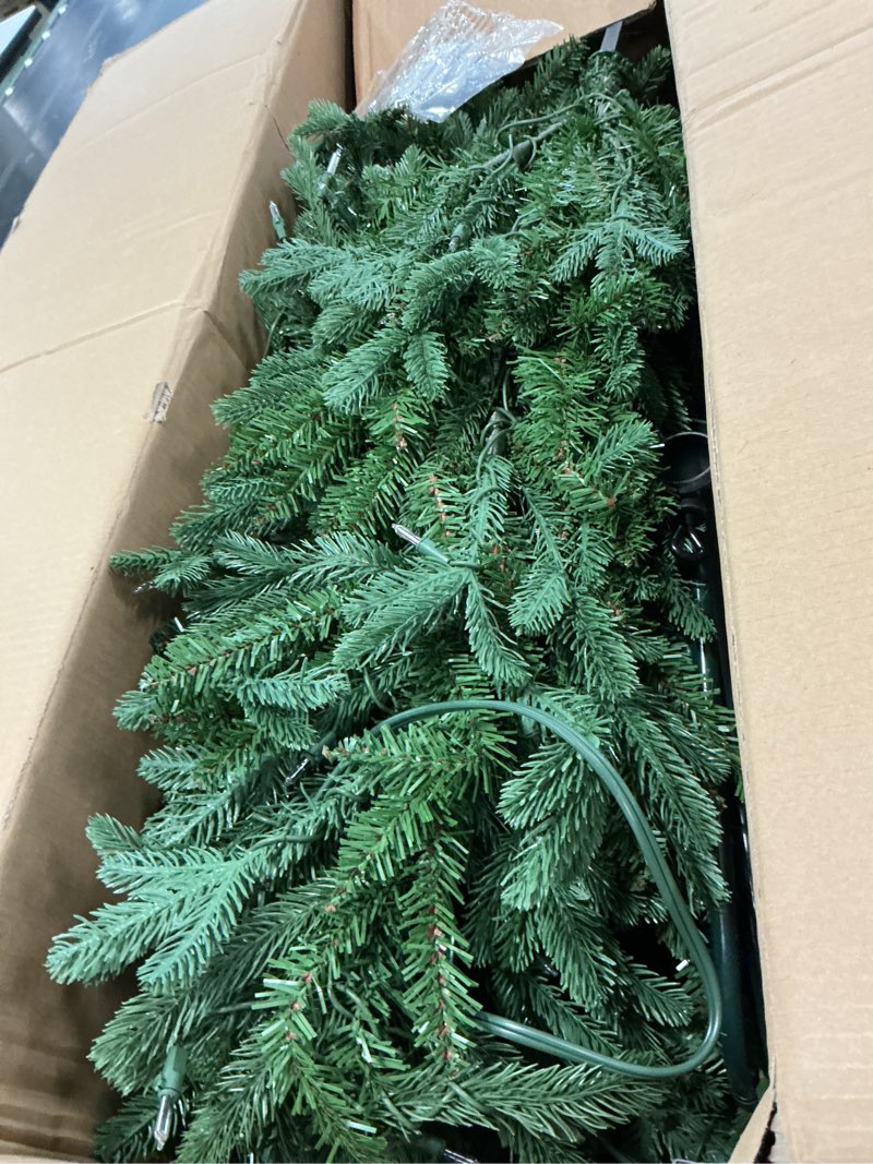 Condition photo showing As Is for National Tree Company Pre-Lit 'Feel Real' Artificial Slim Christmas Tree, Green, Tiffany Fir, White Lights, Includes Stand, 6.5 Feet 6ft 6in Tree