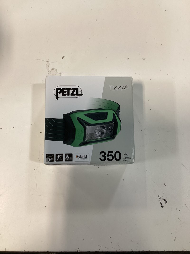 Condition photo showing New/Like New for petzl tikka headlamp (350 lumens) with glow-in-the-dark reflector - green (classic)