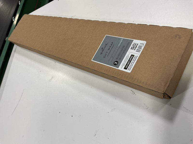 Condition photo showing New/Like New for hallmark foil christmas wrapping paper with cut lines on reverse (3 rolls: 60 sq. ft. ttl) plaid snowflakes, snowmen, red, green and blue plaid red plaid, silver snowflakes, snowman