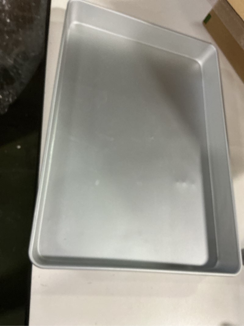 Condition photo showing As Is for Nordic Ware Extra Large High-Sided Baking Pan, 21.1 x 15 x 2 inches, XL Big baking pan Natural Uncoated Aluminum, Reinforced Steel Rim Prevents Warping, Big Batch XL Baking Pan