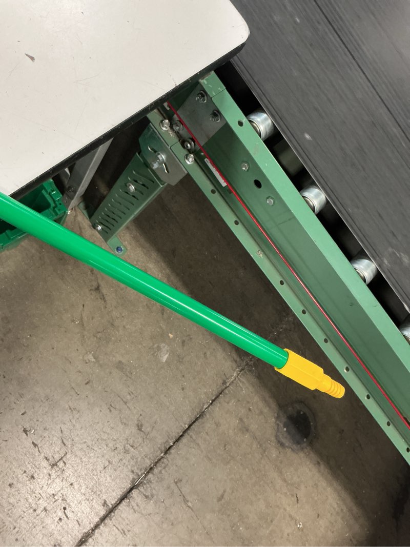 Condition photo showing As Is for green yellow tip broom/sweep handle quckie