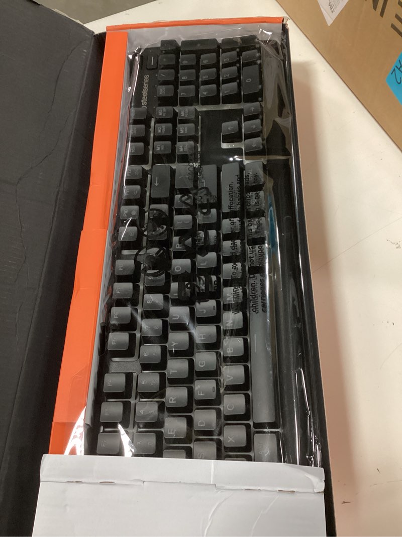Condition photo showing New/Like New for SteelSeries Apex 3 RGB Gaming Keyboard – 10-Zone RGB Illumination – IP32 Water Resistant – Premium Magnetic Wrist Rest (Whisper Quiet Gaming Switch) Black Apex 3 Whisper Quiet – Tactile & Silent