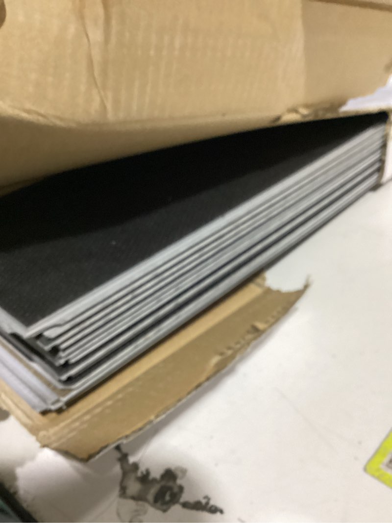 Condition photo showing As Is for style selections sisal oak brown 6-mil x 6-in w x 48-in l waterproof interlocking luxury vinyl plank flooring (23.278-sq ft/ carton)