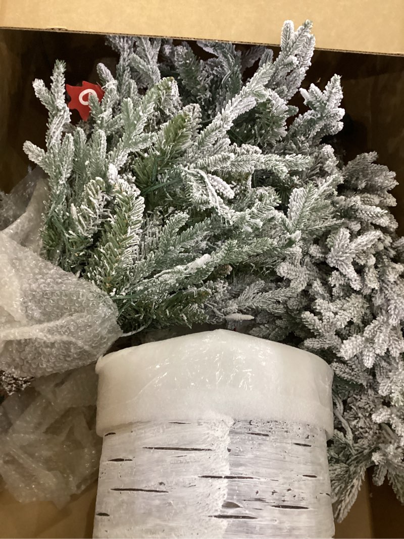 Condition photo showing As Is for Puleo International 6ft Pre-Lit Potted Flocked Arctic Fir Pencil Christmas Tree with 120 Warm White Lights, 1325 Realistic Dense Snow Flocked Branch Tips, Easy Setup Artificial Trees with Sturdy Stand 6' Flocked Arctic Fir 120 Clear Lights