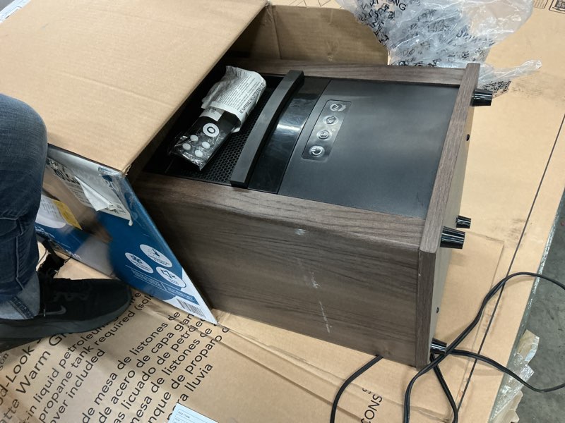 Condition photo showing As Is for Utilitech Infrared Wood Cabinet Heater