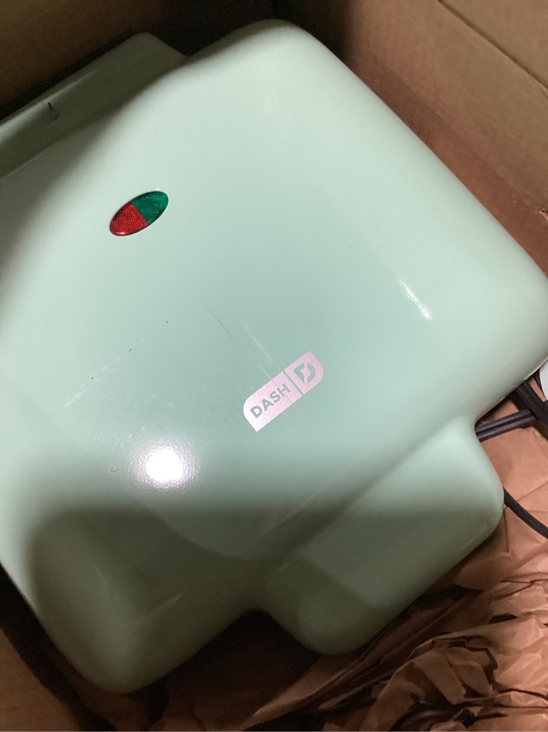 Condition photo showing As Is for dash no-drip waffle maker: waffle iron 1200w + waffle maker machine for waffles, hash browns, or any breakfast, lunch, & snacks with easy clean, non-stick + mess free sides - aqua
