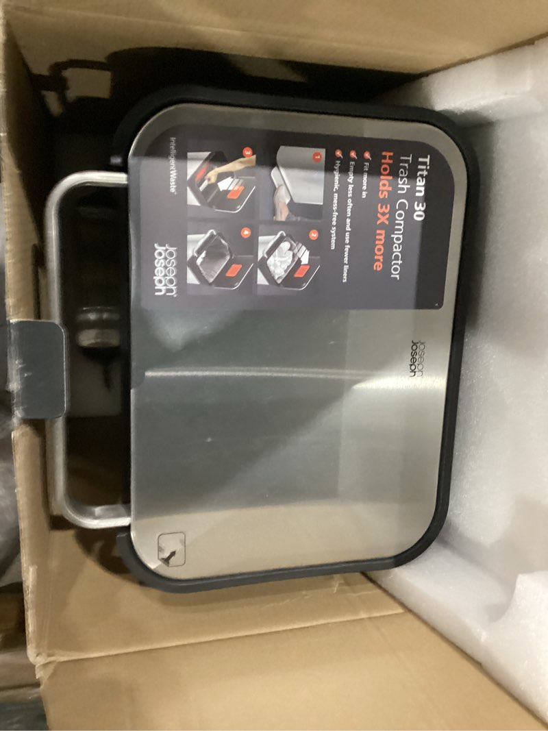 Condition photo showing As Is for Joseph Joseph Intelligent Waste Titan Trash Can Compactor with Odor Filter, Holds Up to 90L After Compaction, Stainless Steel, 30L 30L Stainless Steel