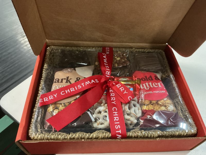 Condition photo showing New/Like New for a gift inside merry christmas chocolate caramel and crunch grand gift basket