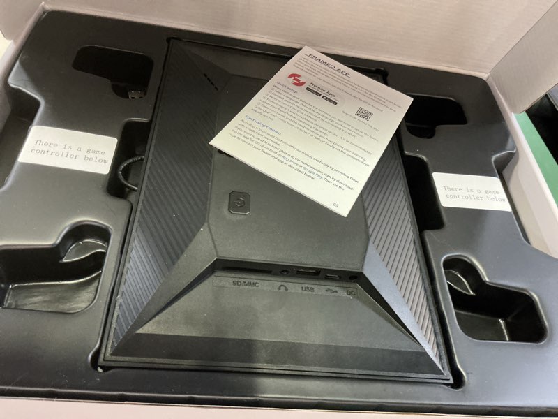 Condition photo showing As Is for 64gb frameo 10.1 inch digital picture frame, 1280x800 hd ips touch screen, smart wifi digital photo frame easy to share photos/videos via frameo app, gaming console with 2 wireless controllers black-64gb