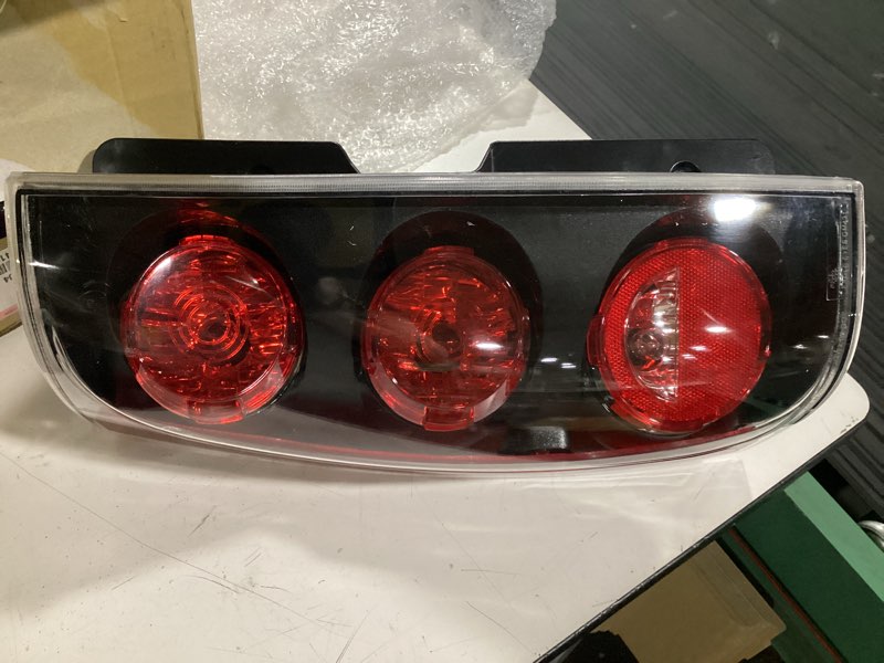 Condition photo showing As Is for trq driver side tail light assembly compatible with 2007-2014 gmc yukon 2007-2011 yukon xl 1500 gm2800215 lta87983