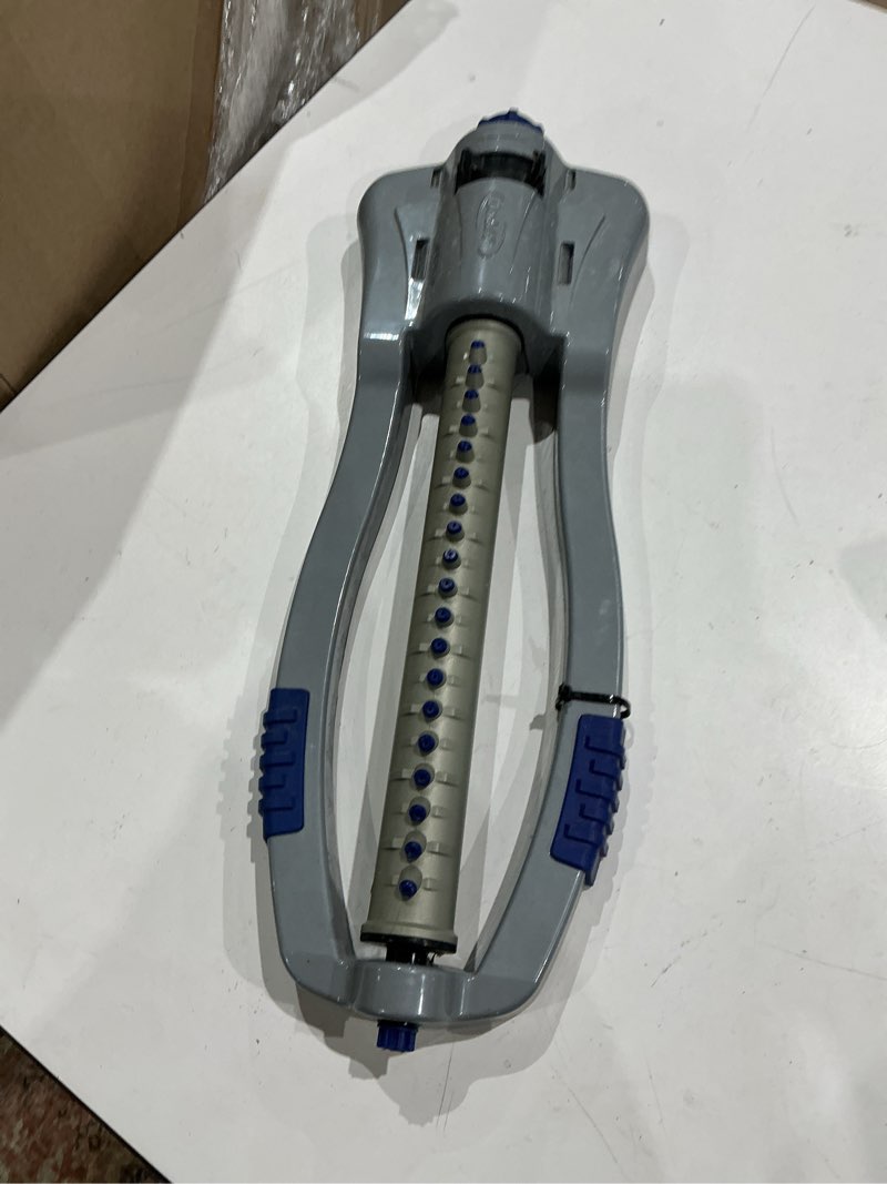 Condition photo showing As Is for orbit max 4000-sq ft oscillating sled lawn sprinkler