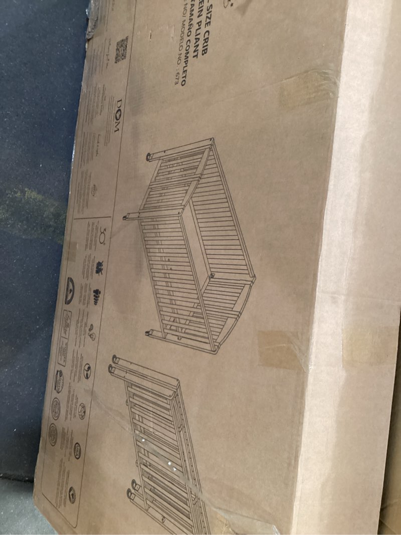 Condition photo showing As Is for dream on me folding full size convenience crib in white, comes with heavy duty locking wheels