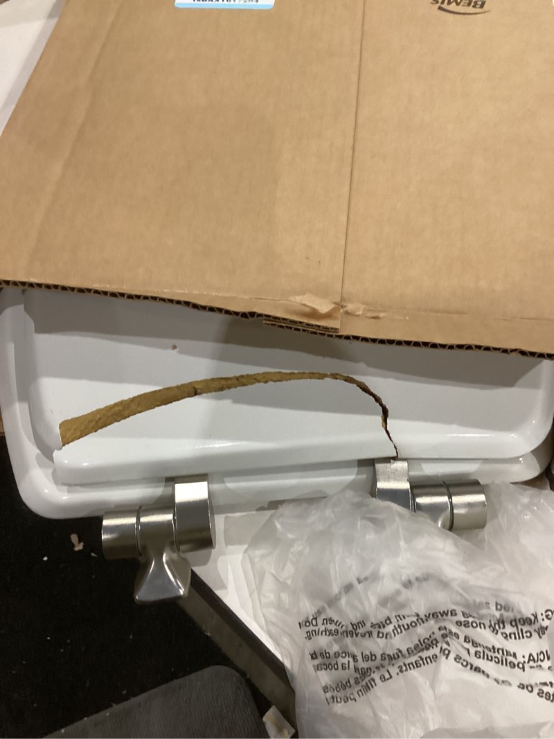 Condition photo showing As Is for mayfair bennett toilet seat with brushed nickel hinges, slow close wood seat, secure metal hinges, easy install, elongated, white elongated brushed nickel