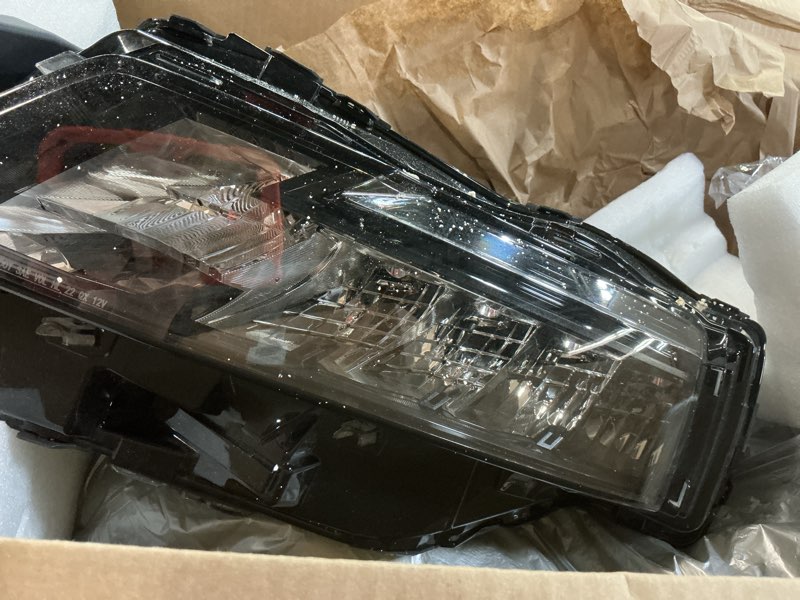 Condition photo showing As Is for trq passenger side headlight assembly chrome bezel compatible with 2019-2021 toyota rav4 north american to2503275 hla89858