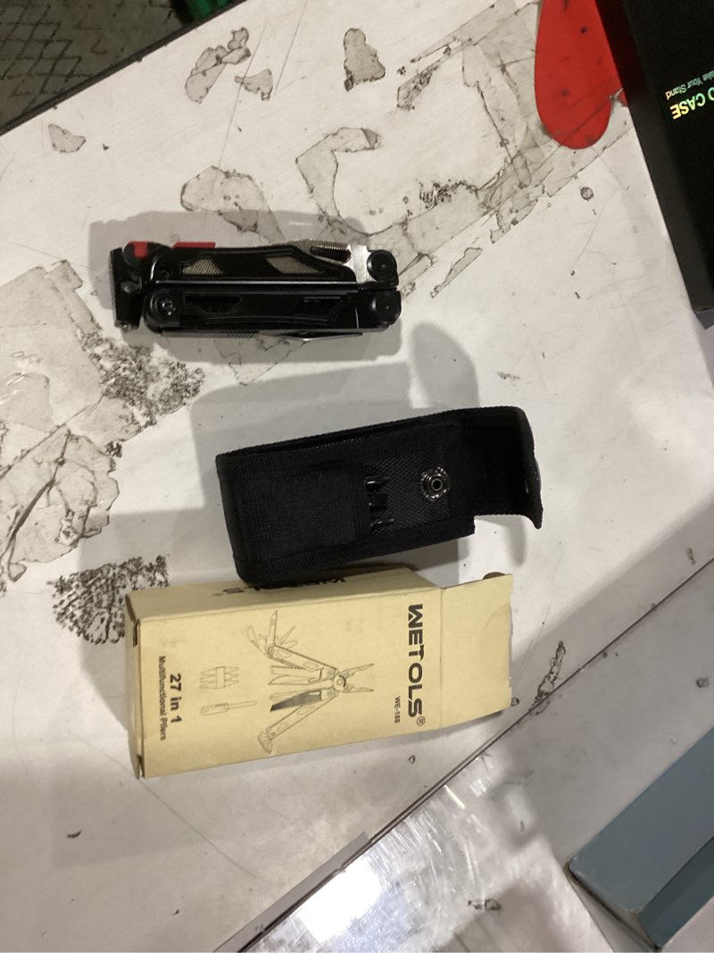 Condition photo showing New/Like New for wetols multitool with pocket knife, 27-in-1 stainless steel needle nose pliers with screwdrivers, self-locking multi tool edc gear with sheath, ideal for survival, outdoor, camping black 27-in-1