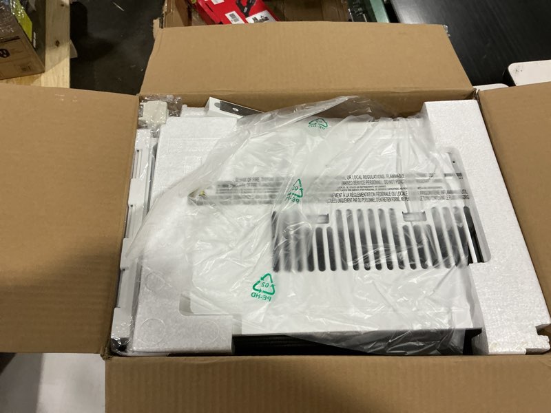 Condition photo showing Good Condition for 5,000 btu 115-volt window air conditioner 150 sq. ft. rooms with remote in white