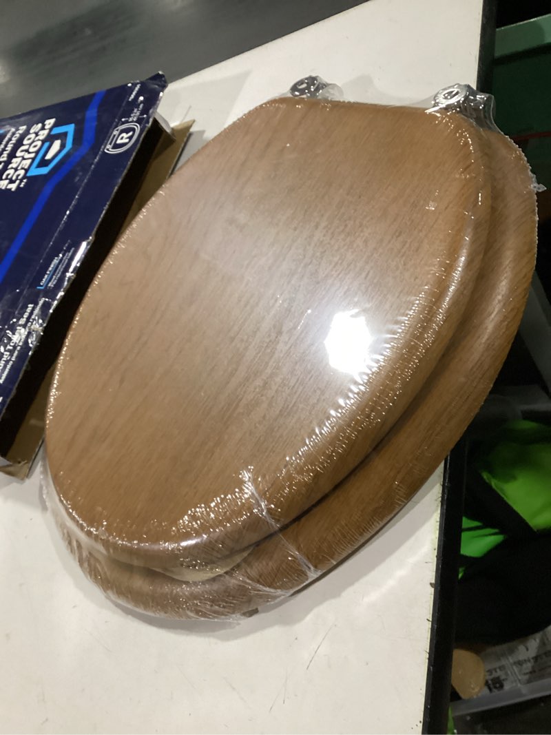 Condition photo showing As Is for Project Source Wood OAK veneer Round Toilet Seat
