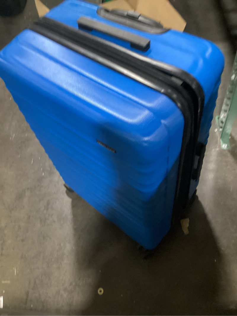 Condition photo showing As Is for Amazon Basics Expandable Hardside Carry-On Luggage, 28-inch Spinner with Four Spinner Wheels and Scratch-Resistant Surface, Light Blue