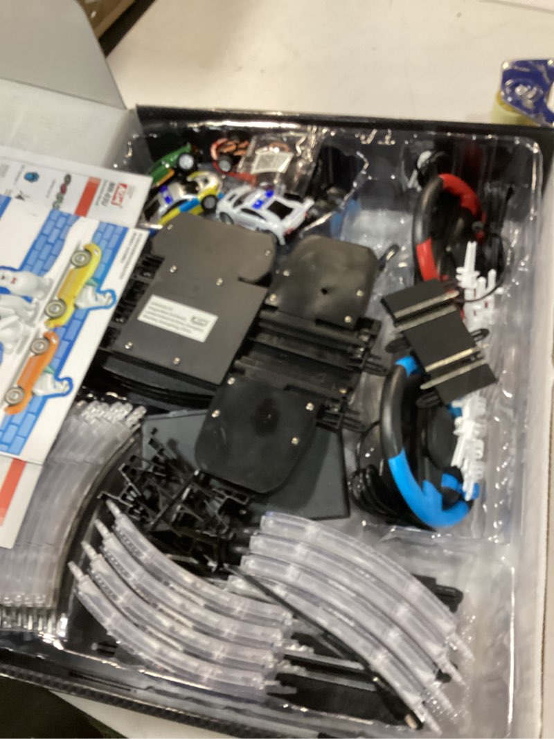 Condition photo showing As Is for AGM MASTECH 18.7ft Slot Car Race Track Set,4 Official Licensed Light-Up Cars, Steering Wheel&Paw Controllers, Adjustable Speed, 4 Flashing Loop Tracks, Dual Power Modes, for Kids 8+, Family Racing Fun