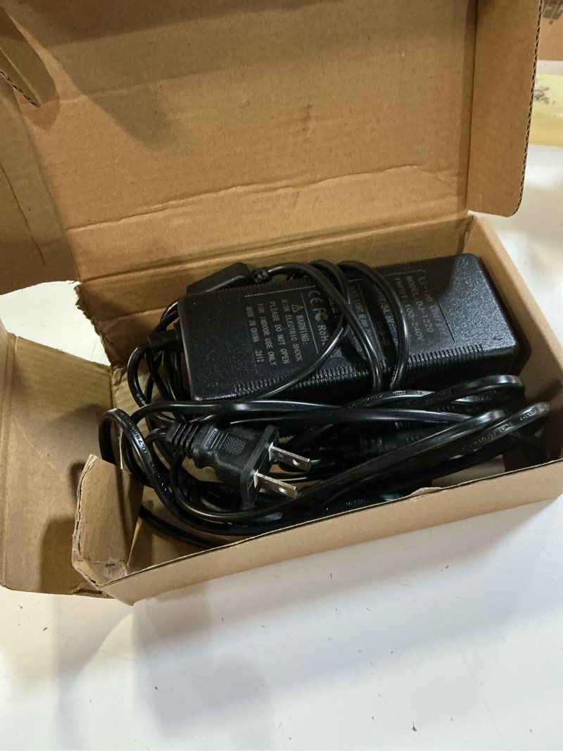 Condition photo showing As Is for electric bike charger 48v, 54.6v 2a charger (5 plugs) fast universal for 48v lithium battery, compatible with ebike, one wheel, electric bicycle, rad power bike