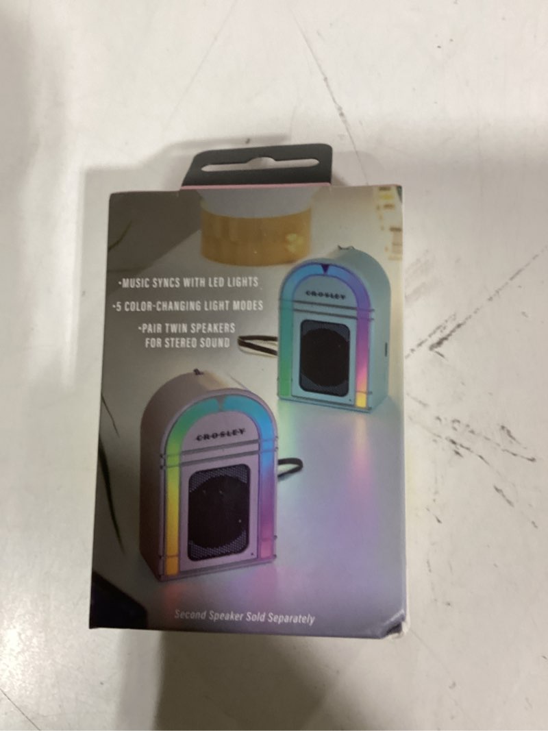 Condition photo showing New/Like New for Crosley CR3046A-PI Mini Jukebox Portable Bluetooth Speaker with LED Lights and Microphone, Pink