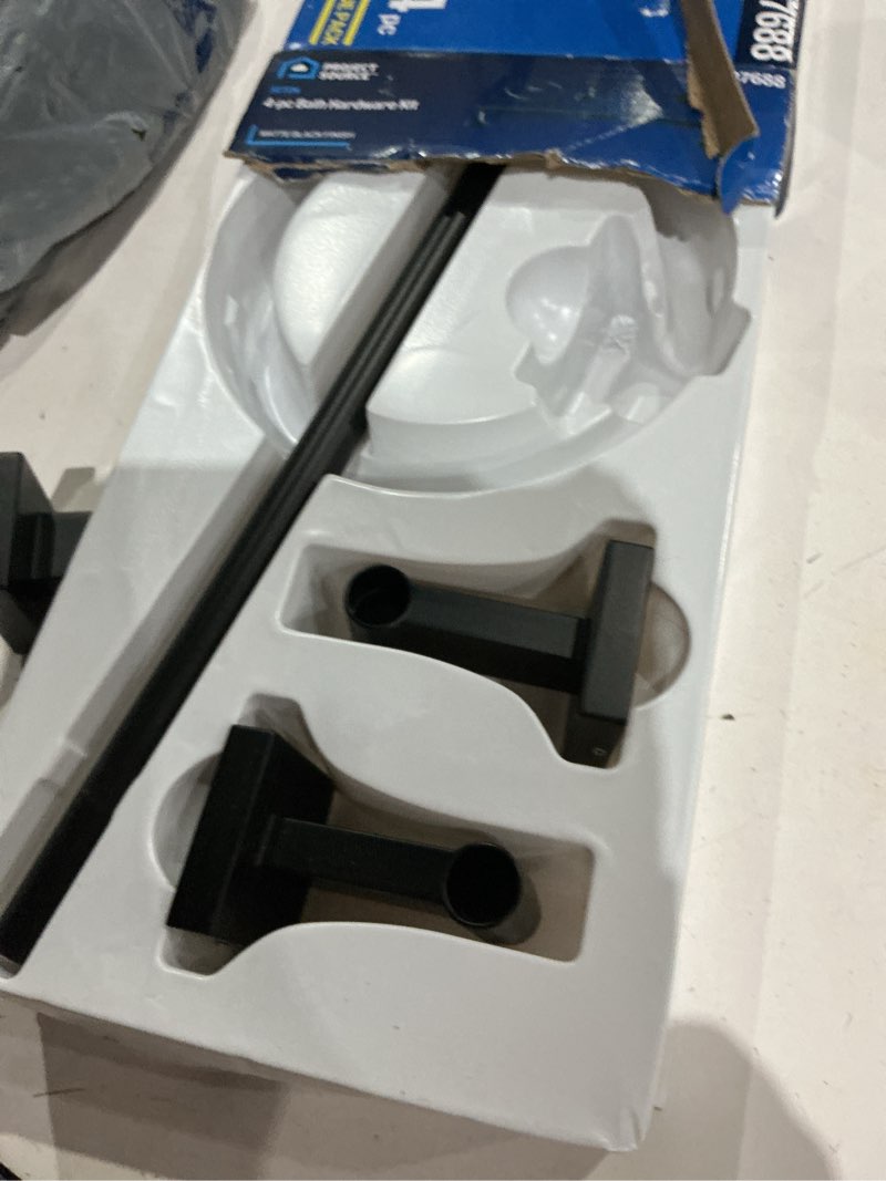 Condition photo showing As Is for project source 4-piece seton matte black decorative bathroom hardware set with towel bar, toilet paper holder, towel ring and robe hook