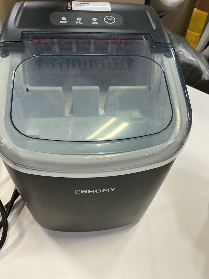 Condition photo showing As Is for euhomy countertop ice maker machine with handle, 26lbs in 24hrs, 9 ice cubes ready in 6 mins, auto-cleaning portable ice maker with basket and scoop, for home/kitchen/camping/rv. (black) black 26lbs
