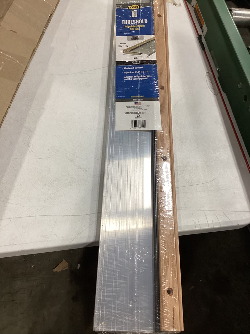 Condition photo showing Good Condition for m-d building products 78600 5-5/8 in. x 1-1/8 in. x 36 in. silver adjustable aluminum & hardwood threshold kit - versatile solution for french and exterior doors silver 5 5/8 in x 36 in