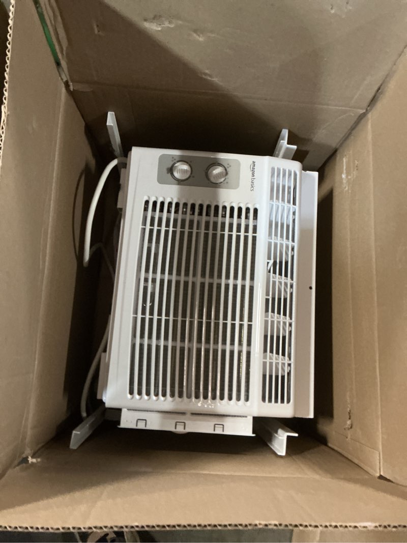 Condition photo showing As Is for amazon basics 5000-btu small window air conditioner, up to 150 sqf, window ac units with cool and fan functions, washable filter, adjustable window kit, intuitive mechanical controls, white white 5000 btu