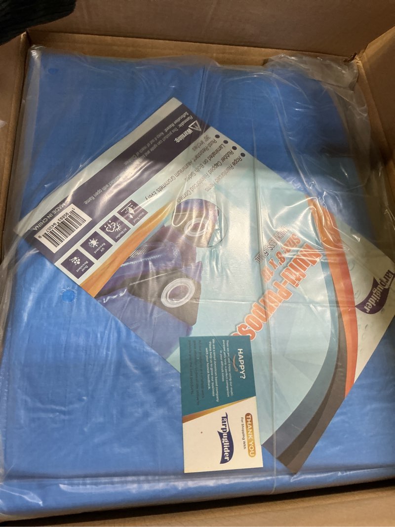 Condition photo showing item condition for Blue Tarp Pack of 4 Tarps Heavy Duty waterproof 8x10 Large Multipurpose Poly Outdoor Tarps Cover 5 Mil Thickness Blue Tarpaulin Reinforced Rip Resistant Rubber Edges With Aluminum Grommets