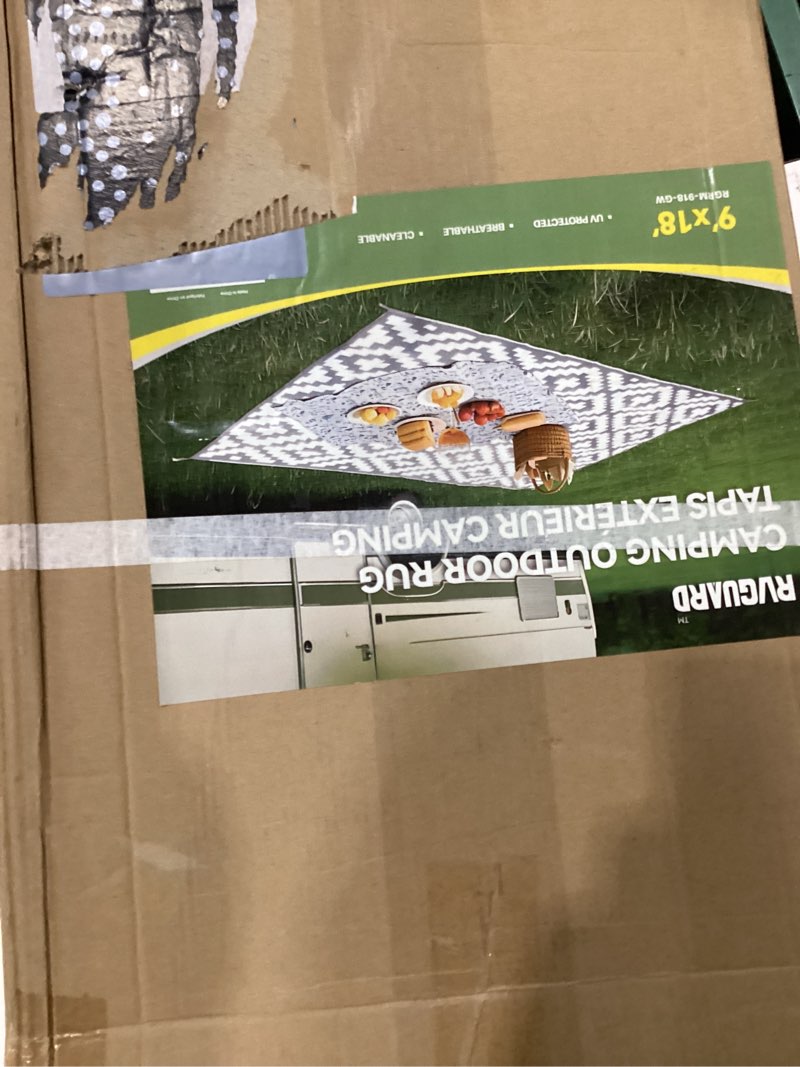 Condition photo showing New/Like New for camping outdoor rug