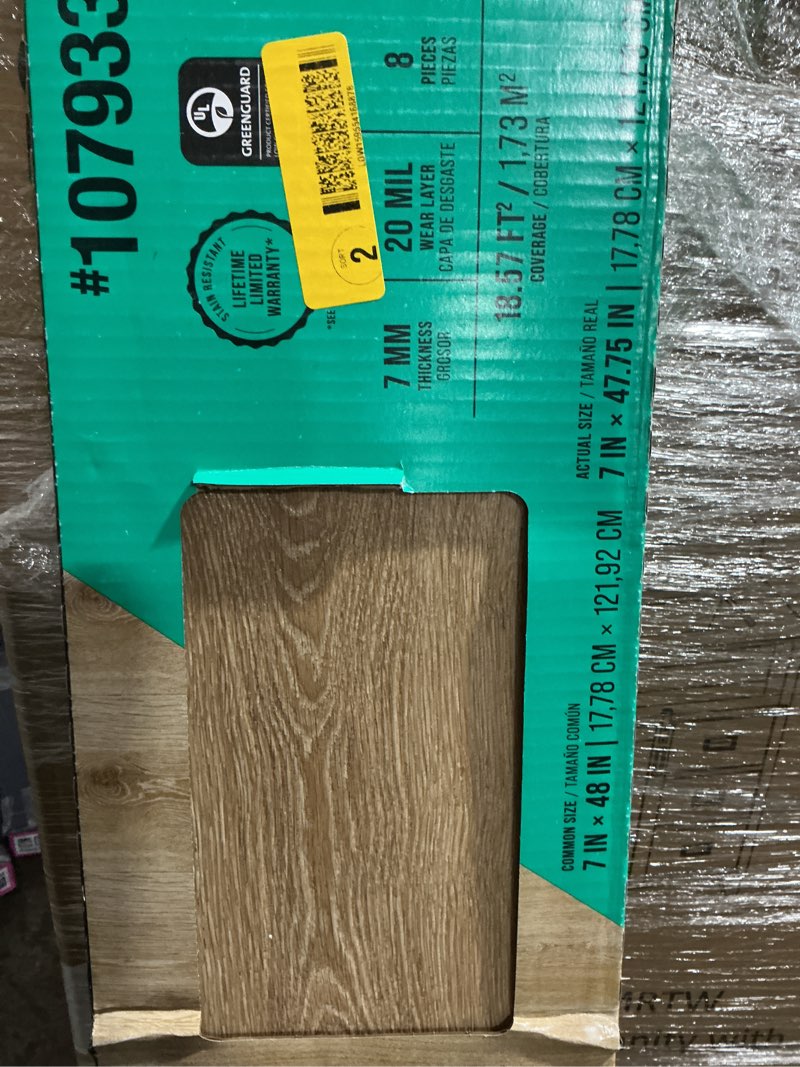 Condition photo showing As Is for stainmaster petprotect bascom park brown 20-mil x 7-in w x 48-in l waterproof interlocking luxury vinyl plank flooring (18.57-sq ft/ carton)